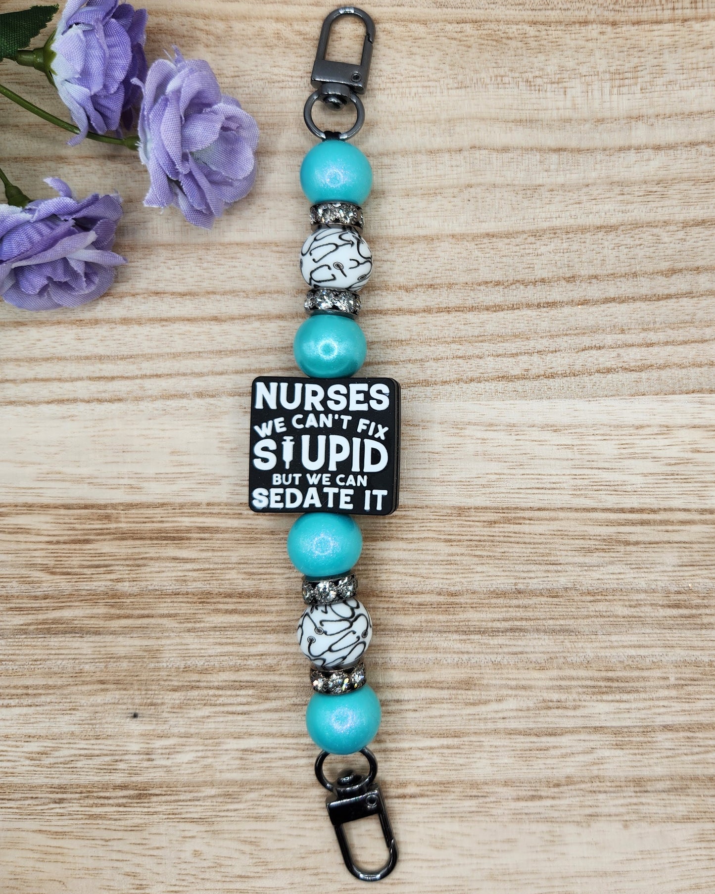 Kindle/Tablet Strap-Nurses We Can't Fix Stupid But We Can Sedate It (Turquoise Opal)